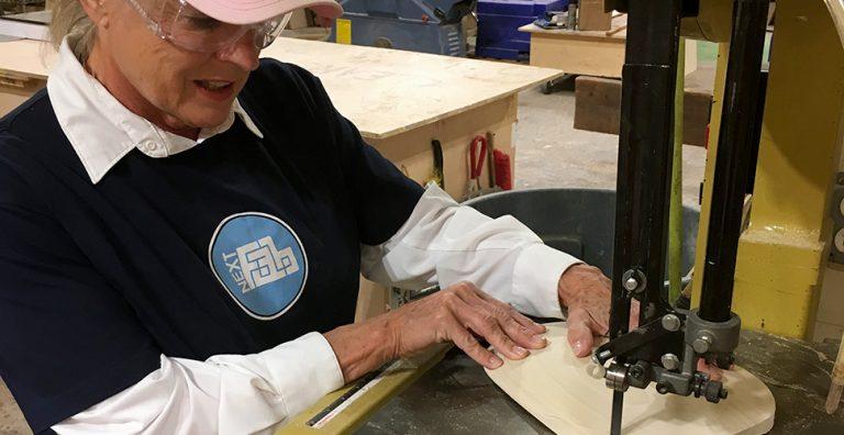 Webinar: Manufacturing your product 1 Woman working at a jig saw.