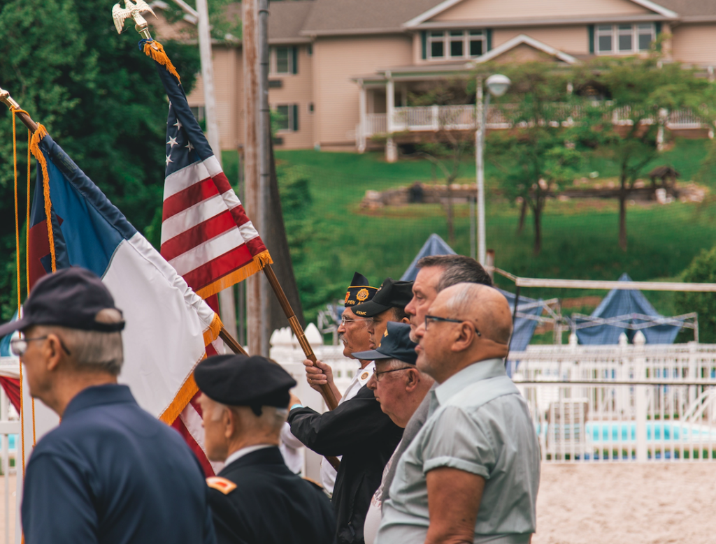 2023 Veterans Innovation and Entrepreneurship Program 1 side view of men marching with flags at a parade