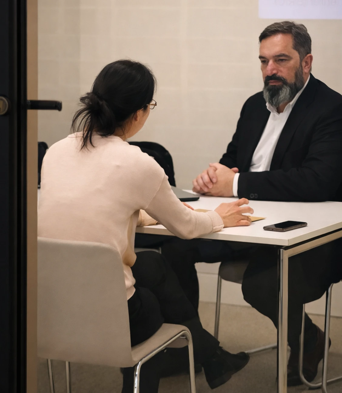 Consultation between a client and a patent agent at Keeley DeAngelo, LLP, focused on patent applications and innovation strategies.